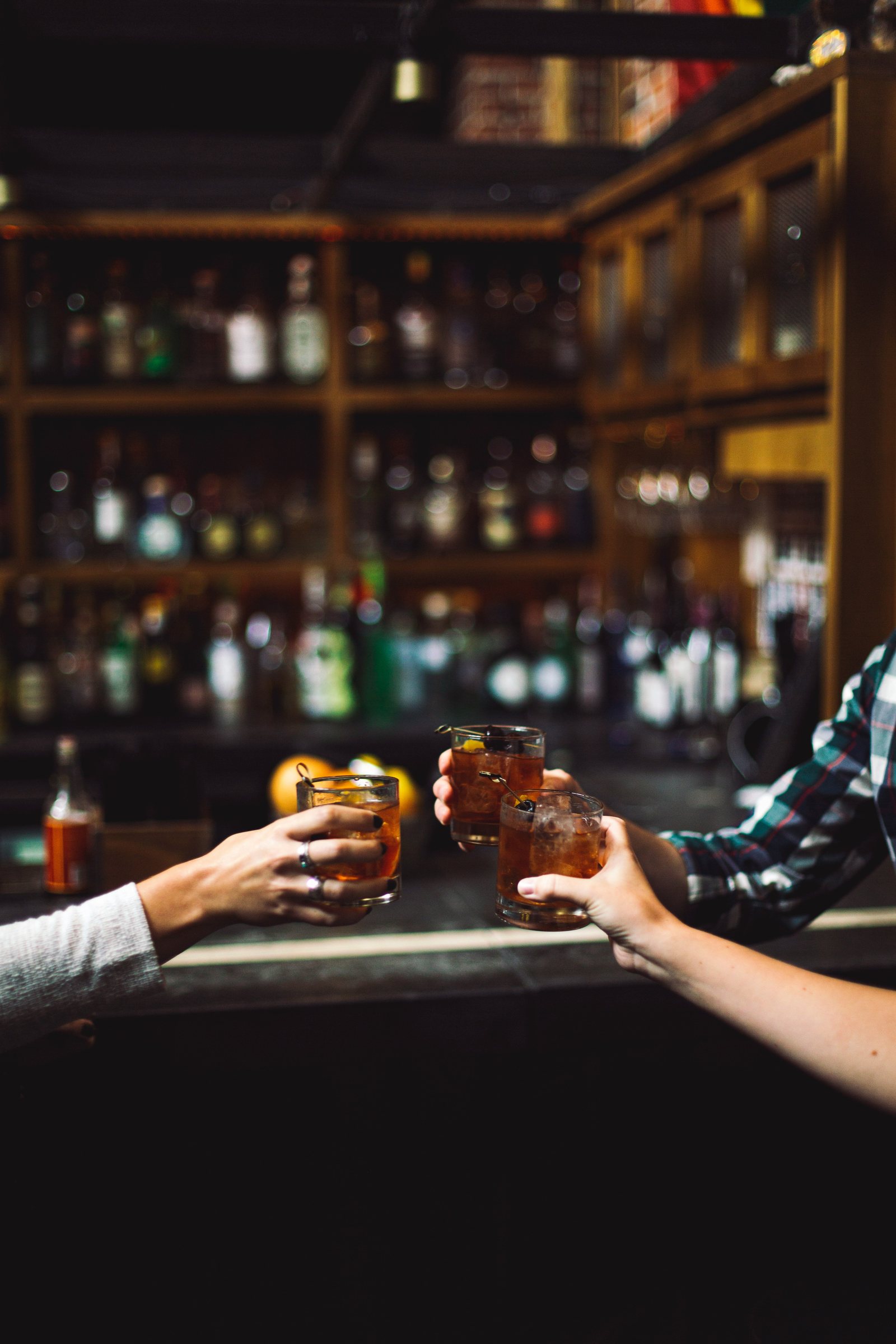 Guests raising glasses together during a private evening at Noir House